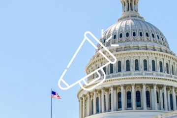 Government building with bullhorn icon.
