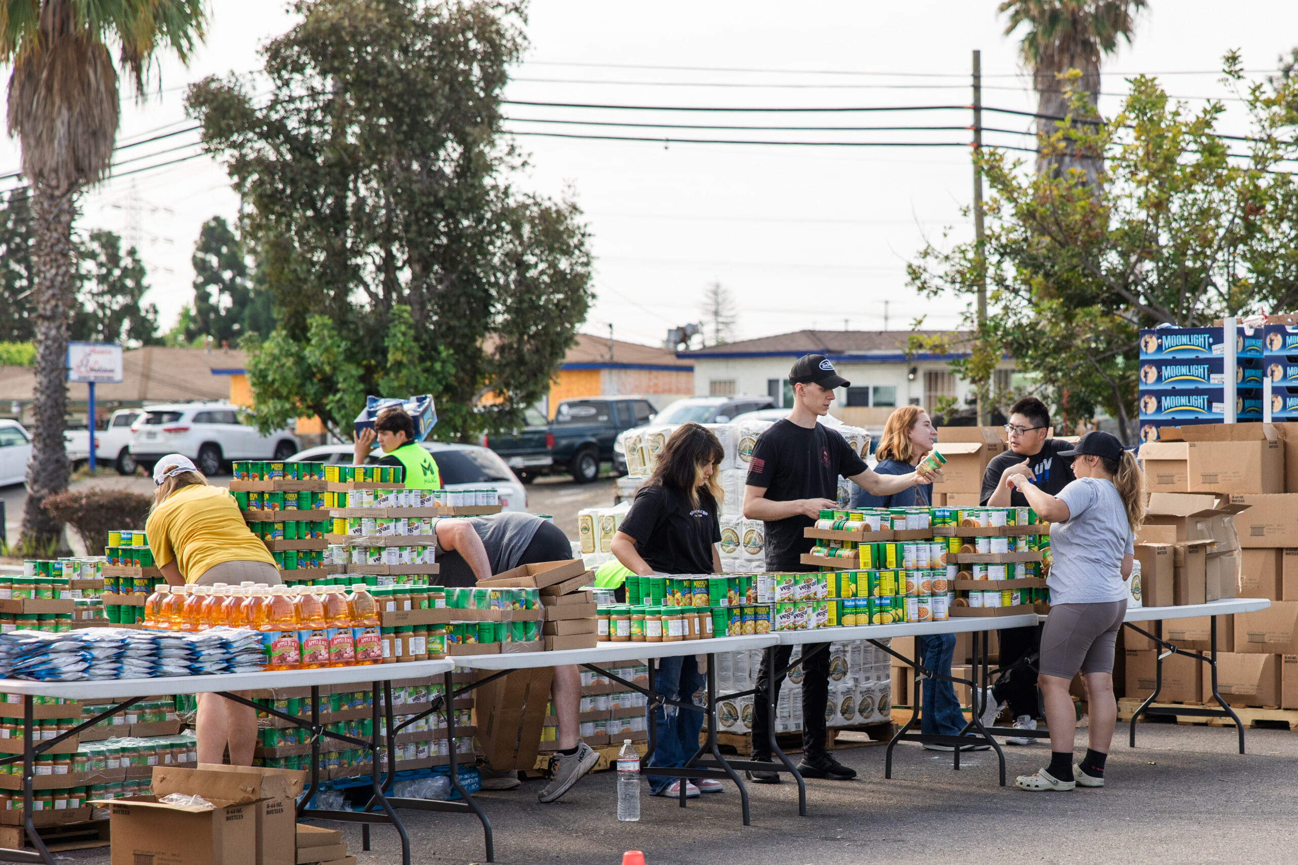Volunteers sorting food at a neighborhood food distribution