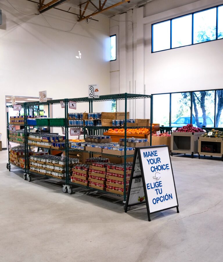 Our North County Client Choice Pantry with nonperishable and fresh produce on racking.