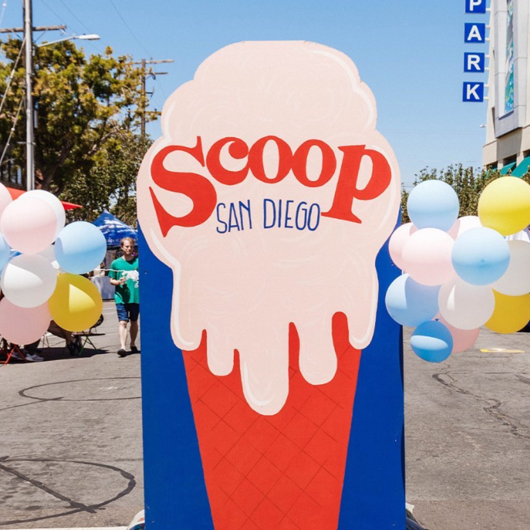Scoop San Diego sign at an event supporting the Food Bank.