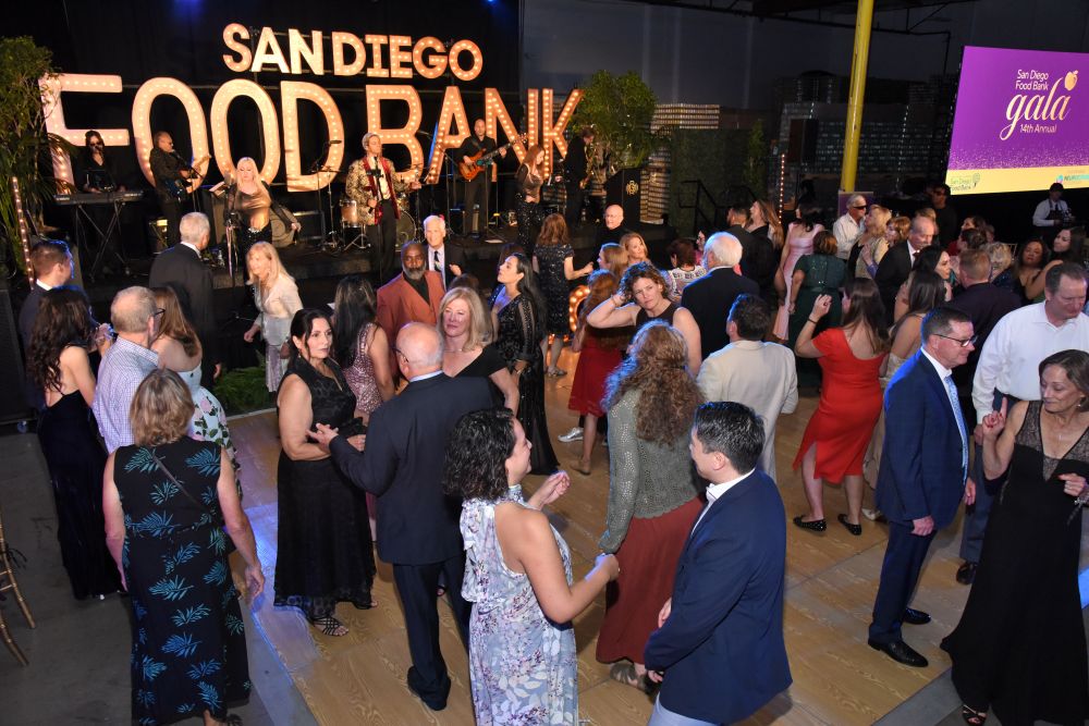 A dance floor full of attendees dancing.