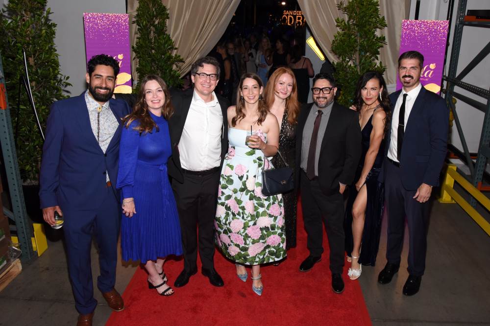 A group of gala attendees on the red carpet.