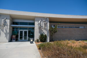 "Summer Lunch at 12 p.m." sign outside Skyline Hills Library.