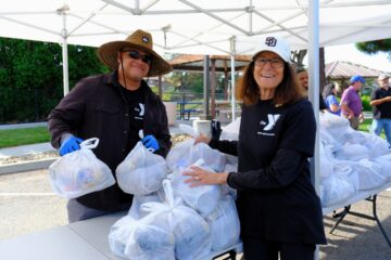 Volunteers help out at sites throughout the county, including ASYMCA and the Food Bank's North County location in Vista.