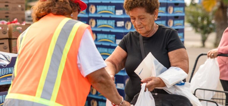 Woman receiving food.